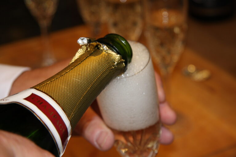 a glass of champagne being poured pre-ceremony